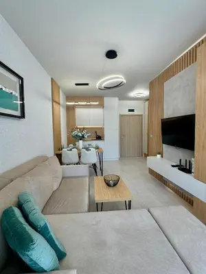 a living room with a couch and a table at Domenico Luxury Apartments in Sunny Beach