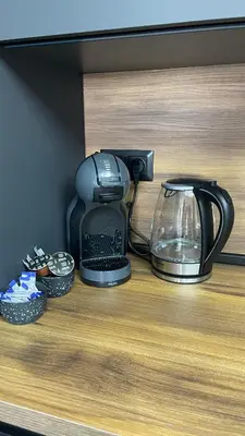 a coffee maker sitting on top of a counter at Тони апартмент in Burgas City