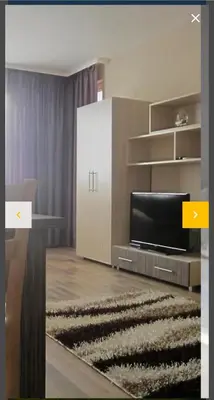 a living room with a tv and a couch at Sozopoli Hills A-17 sea view in Sozopol