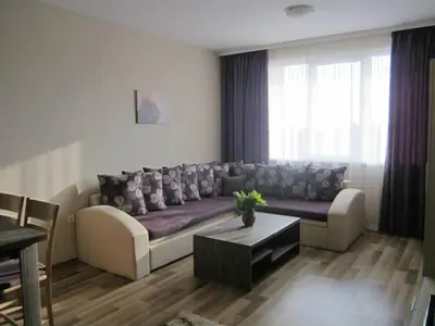 a living room with a couch and a table at Sozopoli Hills A-17 sea view in Sozopol