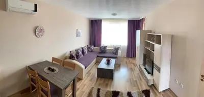 a living room with a couch and a table at Sozopoli Hills A-17 sea view in Sozopol
