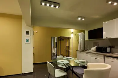 a kitchen with a table and chairs in a room at Beauty 1 FREE PARKING in Burgas City