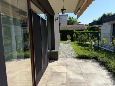 an open door to a house with a patio at Вила Фамилия - Villa Family in Lozenets