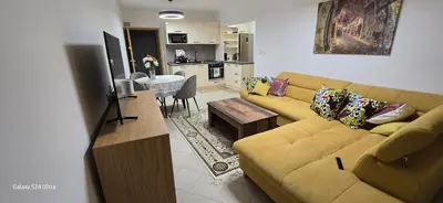 a living room with a couch and a table at Sunny Beach Blue Perl in Sunny Beach