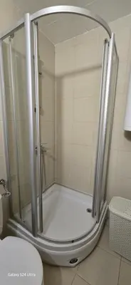 a shower with a glass door in a bathroom at Sunny Beach Blue Perl in Sunny Beach