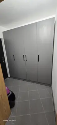 a room with three white cabinets and a tile floor at Sunny Beach Blue Perl in Sunny Beach