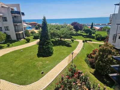a view of a park with trees and the ocean at Diamond beach apartment in Sveti Vlas