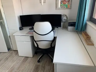 a white desk with a computer monitor and a chair at Seaview Young Family - Семейство на Черно море in Aheloy