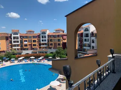 a view of a swimming pool with people and buildings at Seaview Young Family - Семейство на Черно море in Aheloy