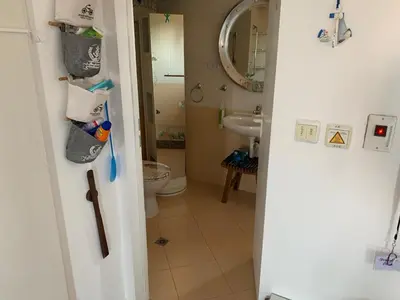 a bathroom with a toilet and a sink at Seaview Young Family - Семейство на Черно море in Aheloy