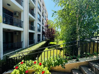 a balcony of a apartment building with flowers on it at ASTORIA II Apartment 12 Sveti Vlas in Elenite