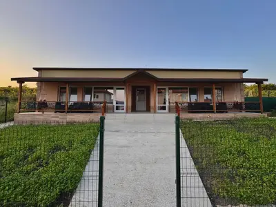 a house with a fence in front of it at Seagull Apartments in Byala
