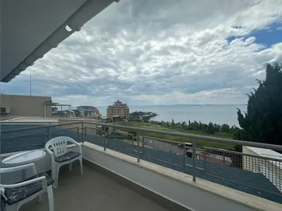 a balcony with chairs and a view of the ocean at Dream holiday Ravda in Ravda