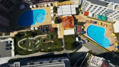 an aerial view of a resort with two swimming pools at Studio 67 & Apartment 16 Rainbow Holiday Complex in Sunny Beach