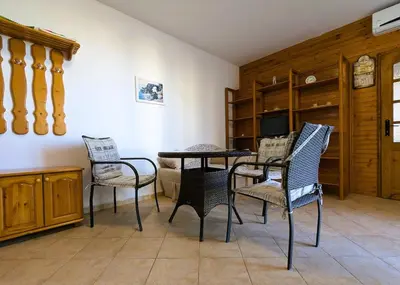 a dining room with a table and chairs at Akrotiri 2BR Apartment in Sozopol