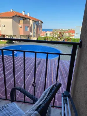 a view of a swimming pool from a balcony at Akrotiri 2BR Apartment in Sozopol