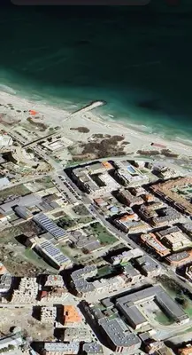 an aerial view of a city next to the water at Апартамент 10 улица Македония 33 in Pomorie