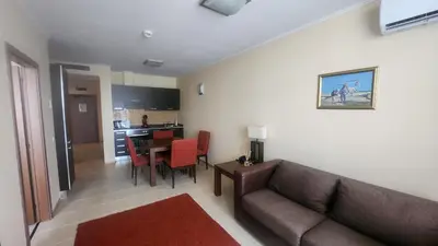 a living room with a couch and a table at Apartment Sunset resort C4-17 in Pomorie