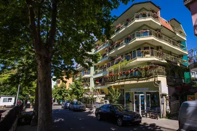 a building with a car parked in front of it at Guest House ,, Ekaterina