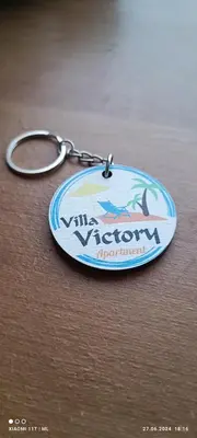 a key chain with a picture of a fish on it at Villa Victory Apartments in Nesebar