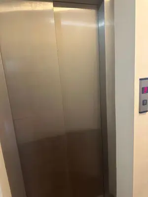 a stainless steel elevator in a room at Kalia A7 Sunny Beach in Sunny Beach