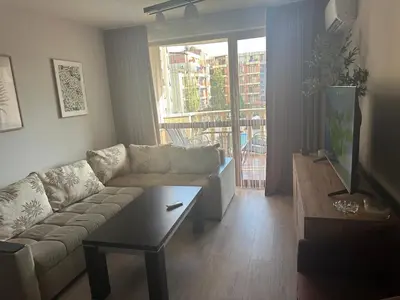 a living room with a couch and a coffee table at Kalia A7 Sunny Beach in Sunny Beach
