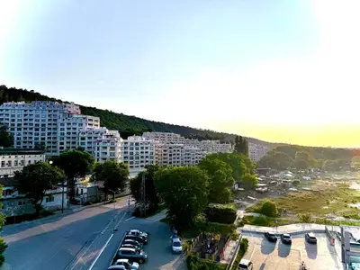 a view of a city with cars parked in a parking lot at ViolaSuite in Varna South Bay by RV Apartments in Varna City