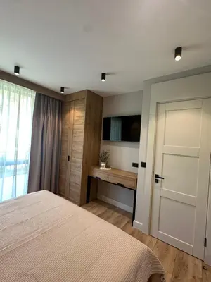 a bedroom with a bed and a sliding door at VIP Anvers Villa 50 in Elenite