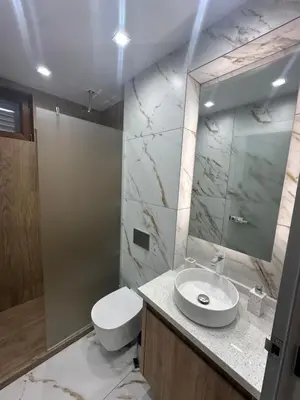 a bathroom with a sink and a toilet and a mirror at VIP Anvers Villa 50 in Elenite