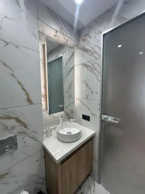 a bathroom with a sink and a mirror at VIP Anvers Villa 50 in Elenite