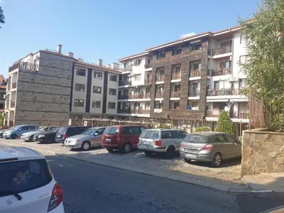 a group of cars parked in a parking lot in front of a building at Двокімнатна квартира у Panorama Bay 2 в Святому Власі Болгарія in Sveti Vlas