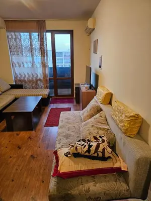 a living room with a couch and a table at Квартира студія у Panorama Bay 2 in Sveti Vlas