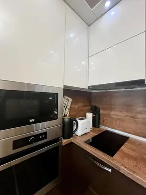 a kitchen with a microwave oven and a sink at Urban Nest Varna - Near Center and Bus Station in Varna City