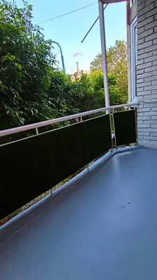 a balcony of a house with a fence at Aperto Sozopoli Apartment in Sozopol