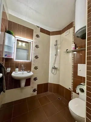 a bathroom with a sink and a toilet at Zornitsa View in Burgas City