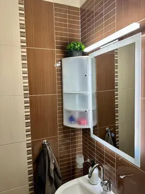 a bathroom with a sink and a mirror at Zornitsa View in Burgas City