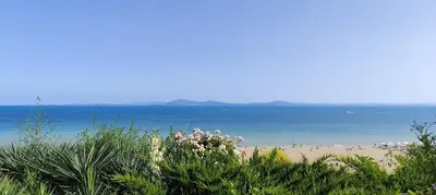 a view of a beach with people in the water at Sea apartment in Burgas City