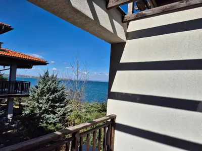 a view of the ocean from a balcony of a house at Eve Santa Marina Sea View Apartment - sea, pools, relax in Sozopol