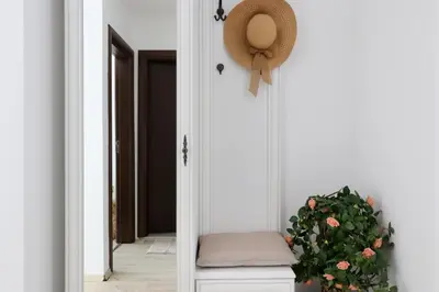 a mirror next to a door with a plant next to it at Stylish Paradiso Apartment 206 in Nesebar