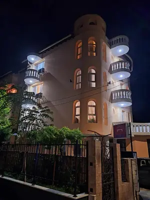 a building with three lights on the side of it at Chance Sarafovo in Burgas City