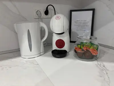 a coffee maker and a blender on a counter at Magnoliya residence in Burgas City