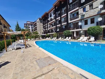 a swimming pool in front of a apartment building at MitProt Panorama Bay 2 Studio 67 in Sveti Vlas