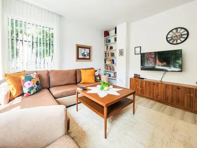 a living room with a couch and a coffee table at The Puzzle in Varna City