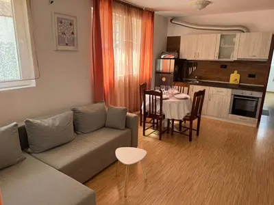 a living room with a couch and a table at Sunny Day 7 in Burgas City