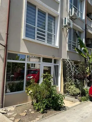 aartment building with a red car in the window at Sunny Day 7 in Burgas City