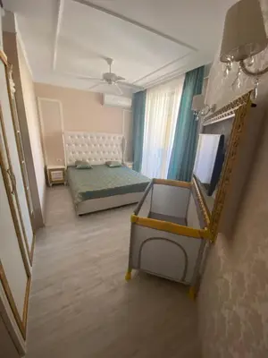a small room with a bed and a mirror at Schöne Ferienwohnung im Harmony Suites Monte Carlo in Sunny Beach