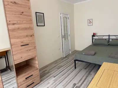 a bedroom with a bed and a large mirror at Mila 6 in Burgas City