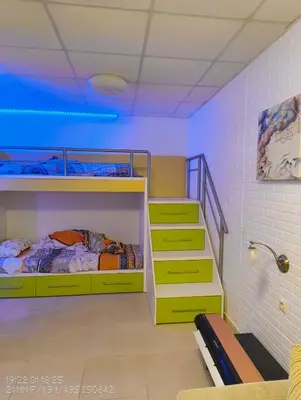 a room with two bunk beds and a staircase at Tarsis nova slunchev Briak Apartament 08 A in Sunny Beach