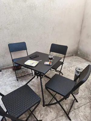 a table with two chairs and a table with a drink at Tarsis nova slunchev Briak Apartament 08 A in Sunny Beach