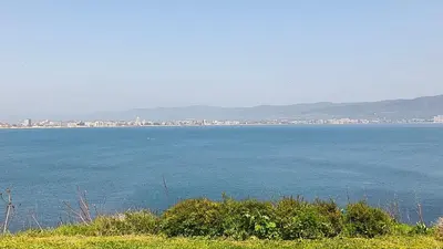 a large body of water with a city in the background at Tarsis nova slunchev Briak Apartament 08 A in Sunny Beach